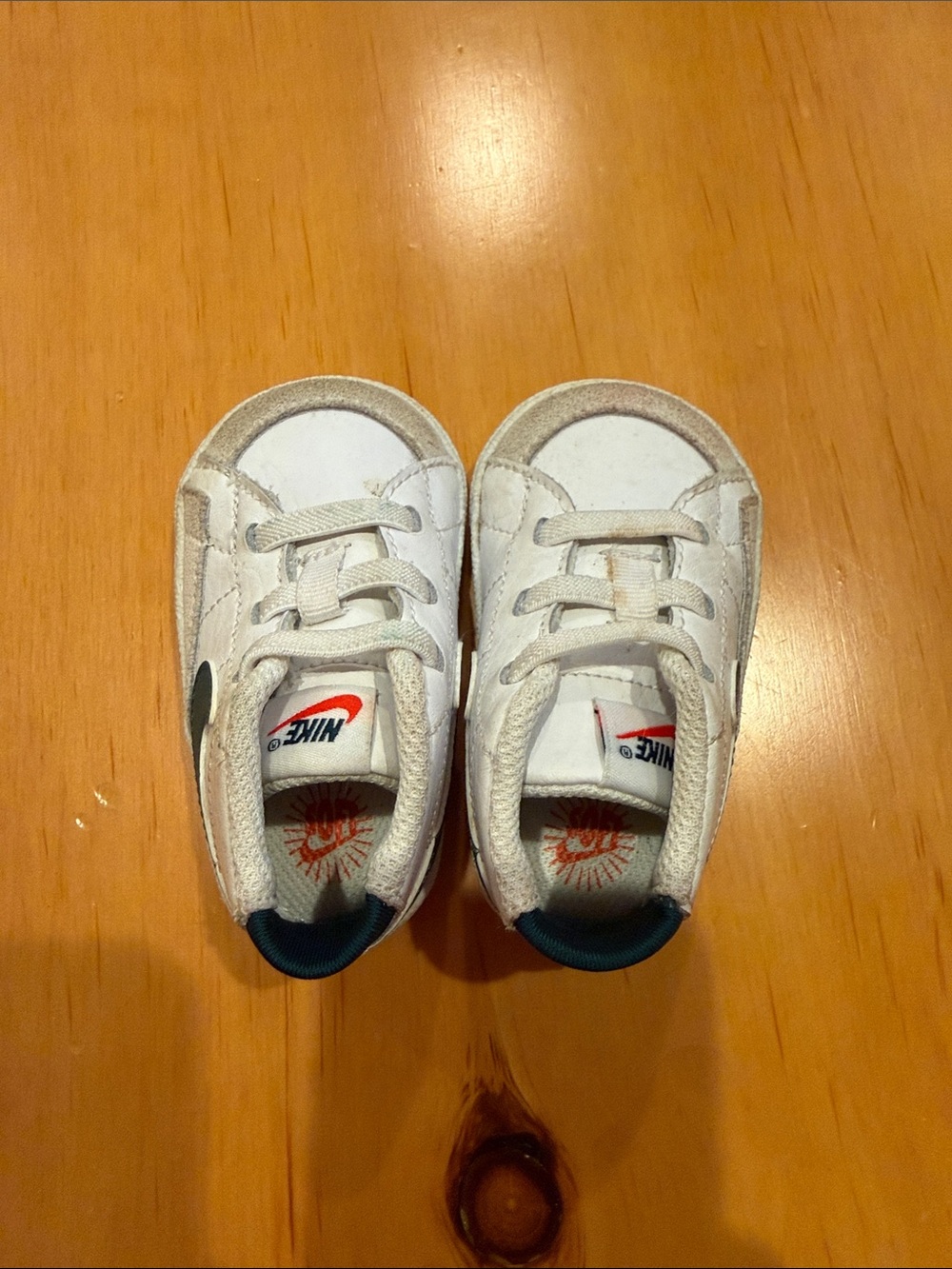 Nike White Toddler Sneakers with Teal Heel and Orange Logo